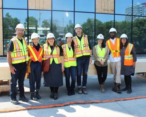 Limberlost Place Team Signs Beam at the Building